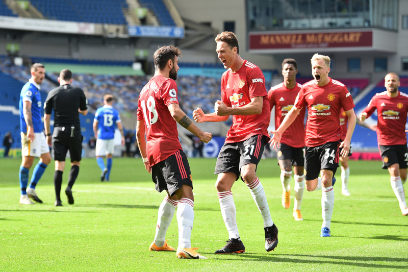 Manchester United's Bruno Fernandes celebrates scoring their third goal with Nemanja Matic during the Premier League match between Brighton & Hove Albion and Manchester United, at The American Express Community Stadium, in Brighton, Britain, on September 26, 2020. Photo: Pool via Reuters