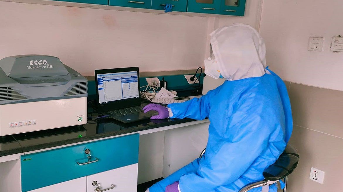 A laboratory staff carrying out polymerase chain reaction test in Seti Provincial Hospital, Dhangadi, on Tuesday. Photo: THT