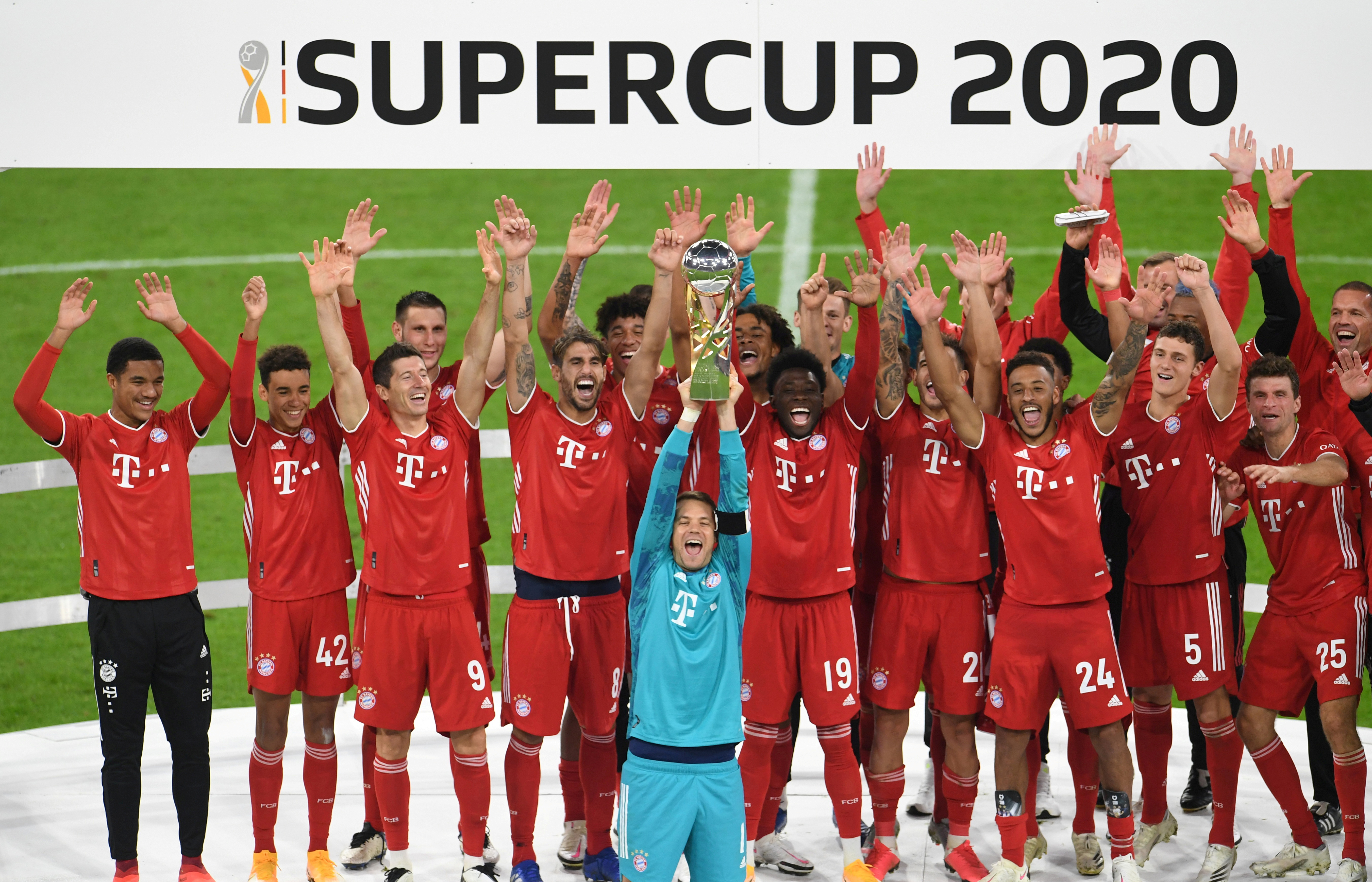 Bayern Munich's Manuel Neuer and teammates celebrate with the trophy after winning the Supercup. Photo: Reuters   