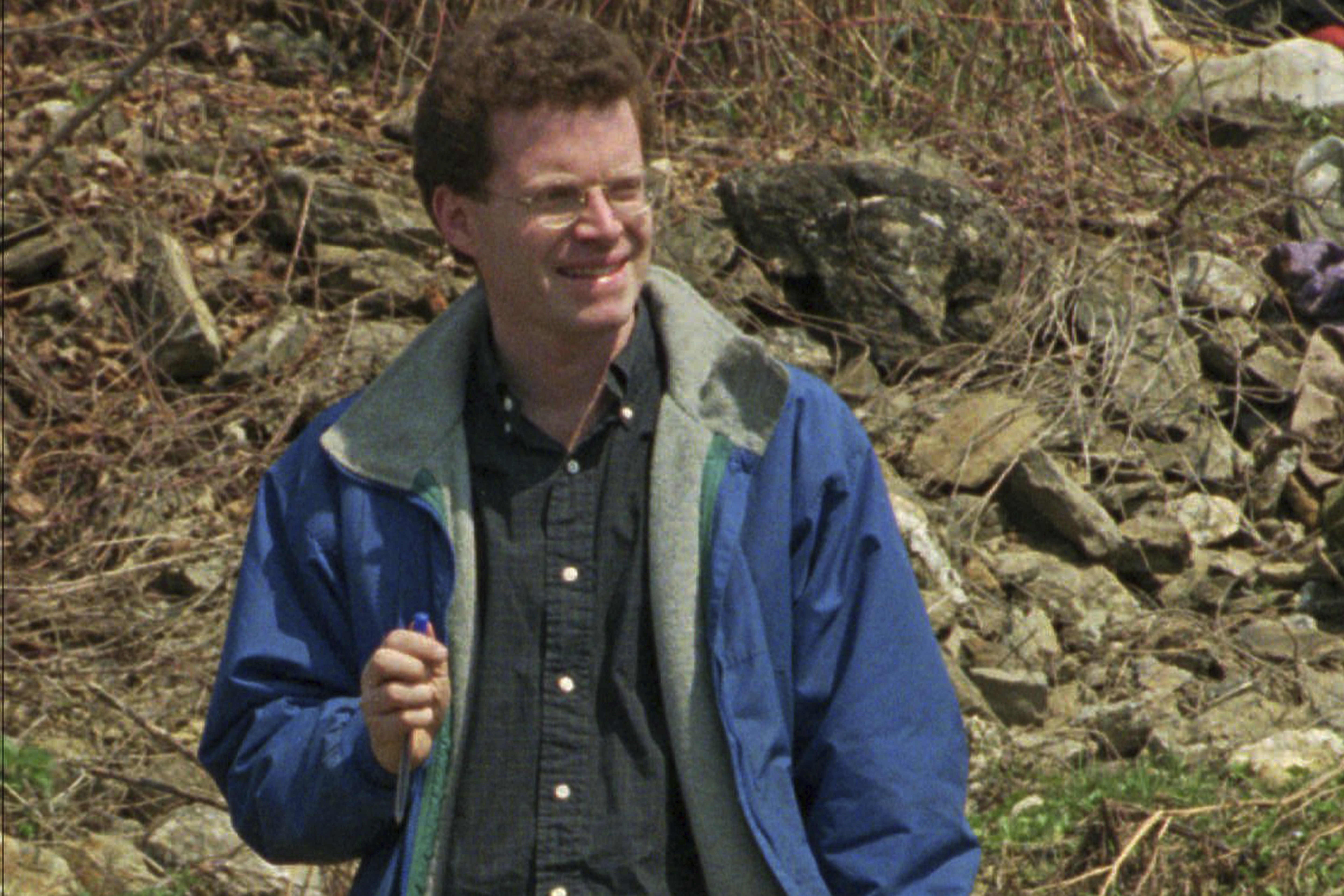 FILE - This April 9, 1996, file photo shows David Rohde, then of The Christian Science Monitor, at a mass grave site in Kravice, Bosnia. Rohde, reporting for the New York Times, and two other men were kidnapped at gunpoint in Afghanistan in 2008. U.S. authorities announced Wednesday, Oct. 28, 2020, that an Afghan man, Haji Najibullah, has been brought to the United States to face charges in the kidnapping. The victims were not identified, but the description matched the kidnapping of Rohde and Afghan journalist Tahir Ludin. Photo: AP