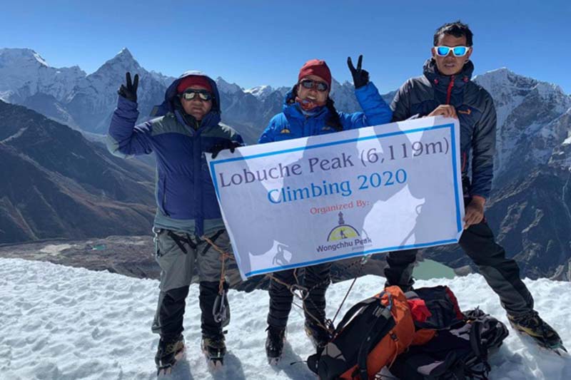 Three-member Nepali expedition team hold a banner atop Mt Lobuche, on Thursday, October 29, 2020. The expedition managed and led by the chairman of Wongchhu Peak Promotion Pvt Ltd, Lakpa Sherpa reached atop Mt Lobuche following the expedition made by 18-member Bahraini team. Photo courtesy: Wongchhu Peak Promotion Pvt.ltd
