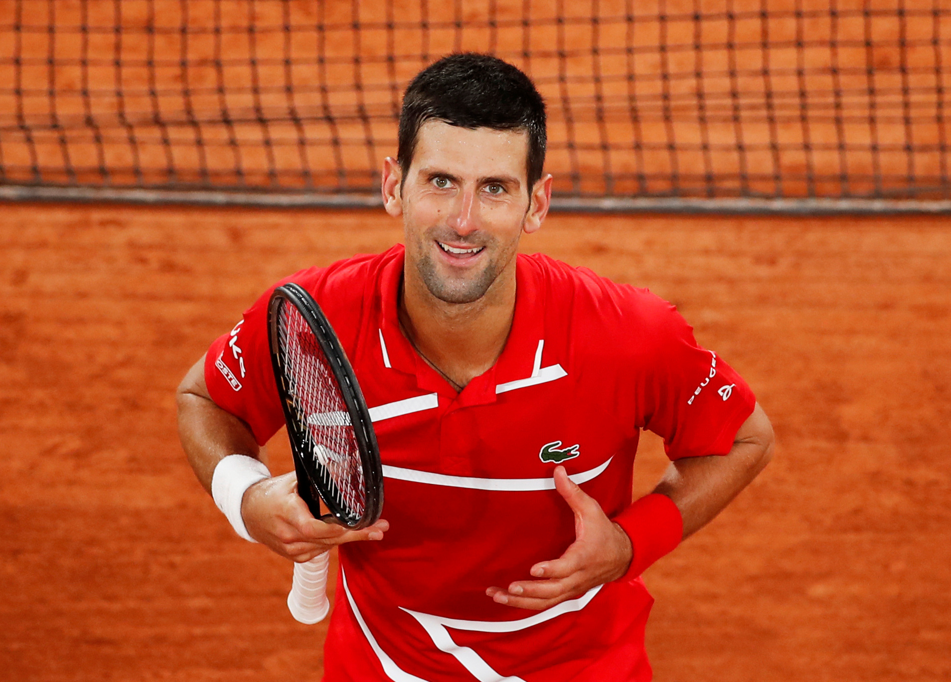 Serbia's Novak Djokovic celebrates winning his fourth round match against Russia's Karen Khachanov. Photo: Reuters 