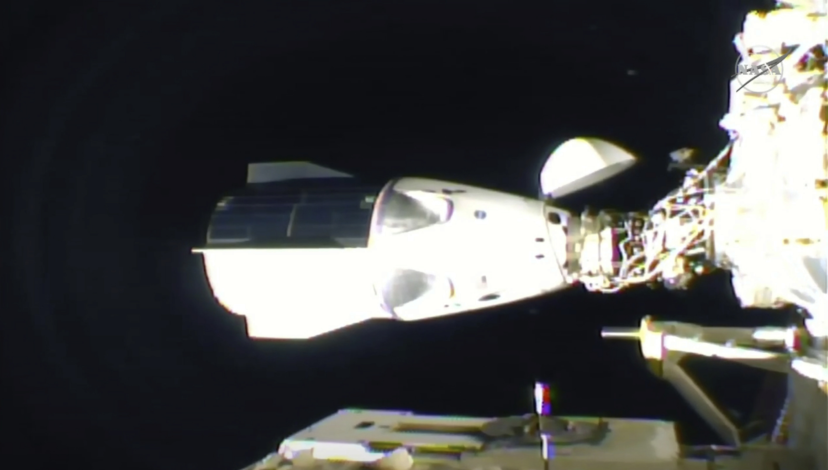 In this frame grab from NASA TV, the SpaceX Dragon is seen after docking at the International Space Station, late Monday, Nov. 16, 2020. Photo: AP