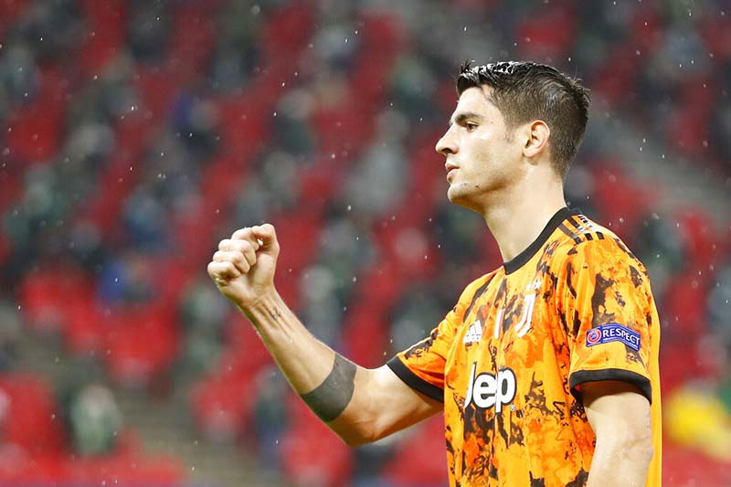 Juventus' Alvaro Morata celebrates after scoring the opening goal during the Champions League Group G soccer match between Ferencvaros and Juventus at the Puskas Arena in Budapest, Hungary, on Wednesday, November 4, 2020. Photo: AP