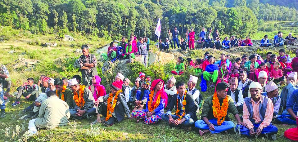 People sitting at a gathering organised by Nepal Communist Party (NCP) in Badimalika Municipality, Bajura, on Thursday. Photo: THT