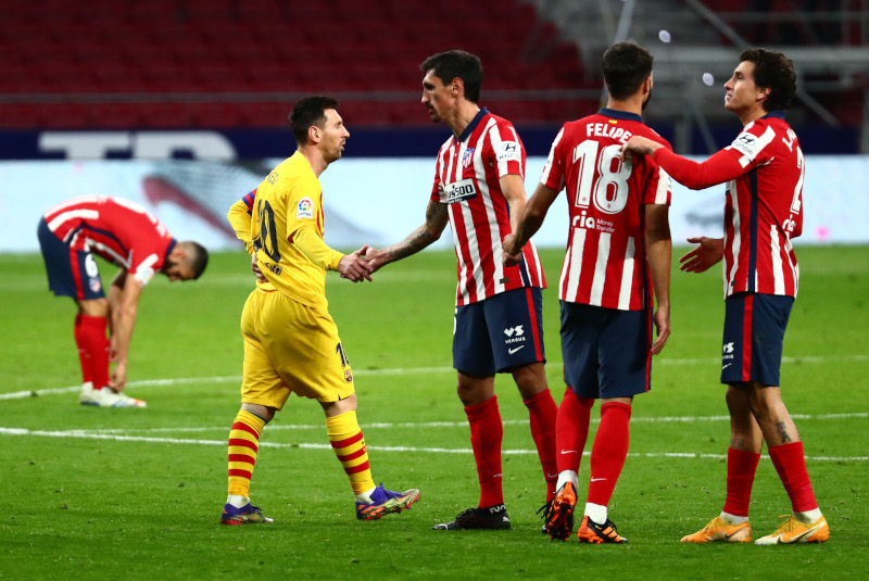 Barcelona's Lionel Messi shakes hands with Atletico Madrid's Stefan Savic at the end of the match during the La Liga Santander between Atletico Madrid and FC Barcelona, at Wanda Metropolitano, in Madrid, Spain, on November 21, 2020. Photo: Reuters