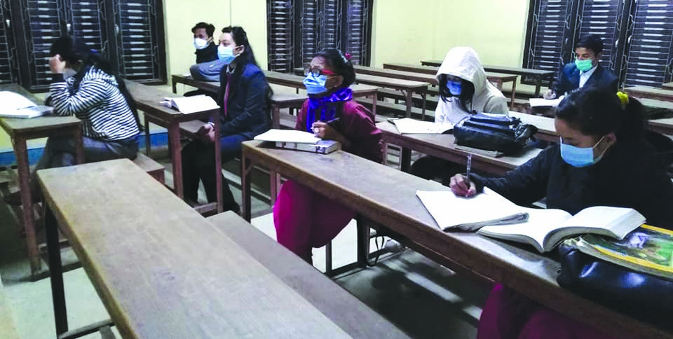 Students attending a class at Nilkantha Multiple Campus, in Dhading, on Tuesday. Photo: THTn