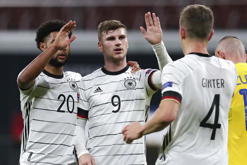 Germany's Timo Werner (centre) celebrates with teammates Serge Gnabry (left), and Matthias Ginter (right) after scoring his team's third goal during the UEFA Nations League soccer match between Germany and the Ukraine at the Red Bull Arena in Leipzig, Germany, on Saturday, November 14, 2020. Photo: AP