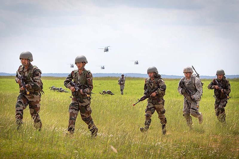 Indian Army soldiers with the 2nd Battalion, 5th Royal Gurkha Rifles and US Army paratroopers with the 1st Brigade Combat Team, 82nd Airborne Division move toward their objective after being dropped off by US Army CH-47 Chinook helicopters for a field training exercise at Fort Bragg, NC, on May 11, 2013, during exercise Yudh Abhyas 2013. Yudh Abhyas is an annual bilateral training exercise between the Indian Army and US Army Pacific, hosted by the XVIII Airborne Corps. Photo courtesy: US Army Sgt Michael J MacLeod/Released