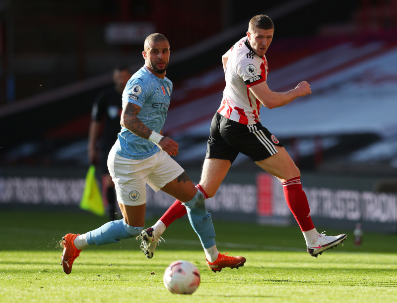 Manchester City's Kyle Walker in action with Sheffield United's John Lundstram during their Premier League match at Bramall Lane, in Sheffield, Britain, on October 31, 2020. Photo: Pool via Reuters