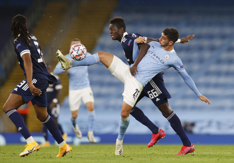 Manchester City's Ferran Torres in action with Olympiacos' Pape Abou Cisse during the Champions League  Group C match between Manchester City and Olympiacos, at  Etihad Stadium, in Manchester, Britain, on November 3, 2020. Photo: Reuters