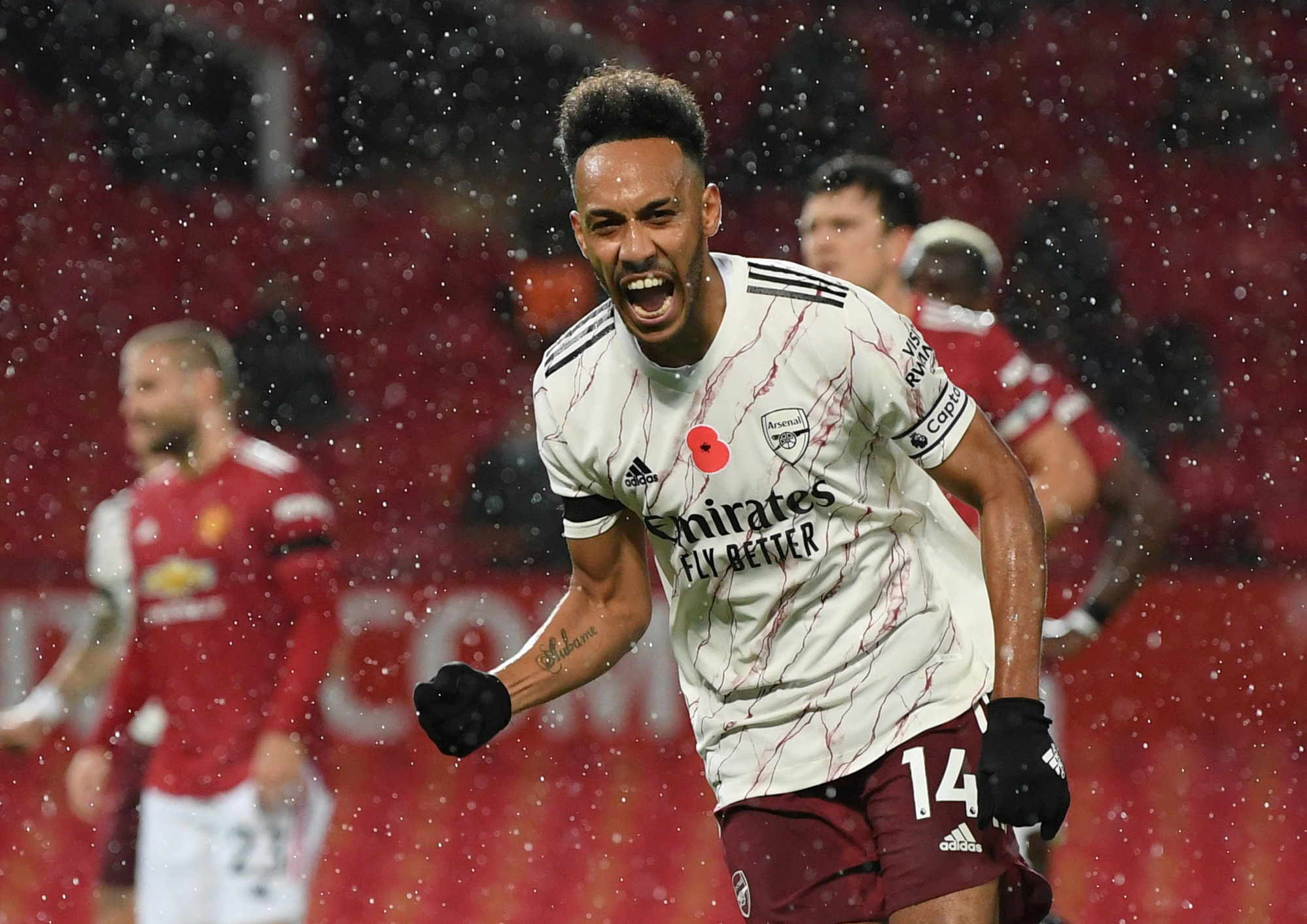 Arsenal's Pierre-Emerick Aubameyang celebrates scoring their first goal n during the Premier League match between Manchester United and Arsenal, at Old Trafford, in Manchester, Britain, on November 1, 2020. Photo: Pool via Reuters