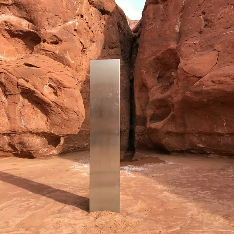 This Nov. 18, 2020 photo provided by the Utah Department of Public Safety shows a metal monolith installed in the ground in a remote area of red rock in Utah.  Photo: Utah Department of Public Safety via AP