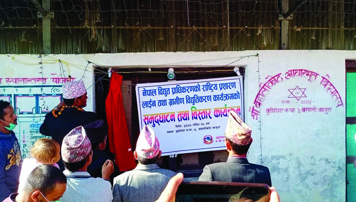 Lawmaker Lal Bahadur Thapa inaugurating the expanded national electricity grid, in Bajura, on Sunday. Photo: THT
