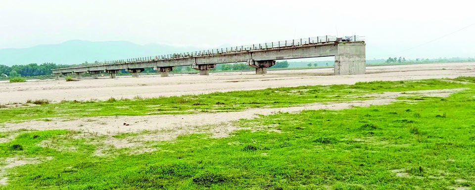 A view of an under-construction bridge over the Triyuga River in Udayapur, on Monday. Photo: THTn