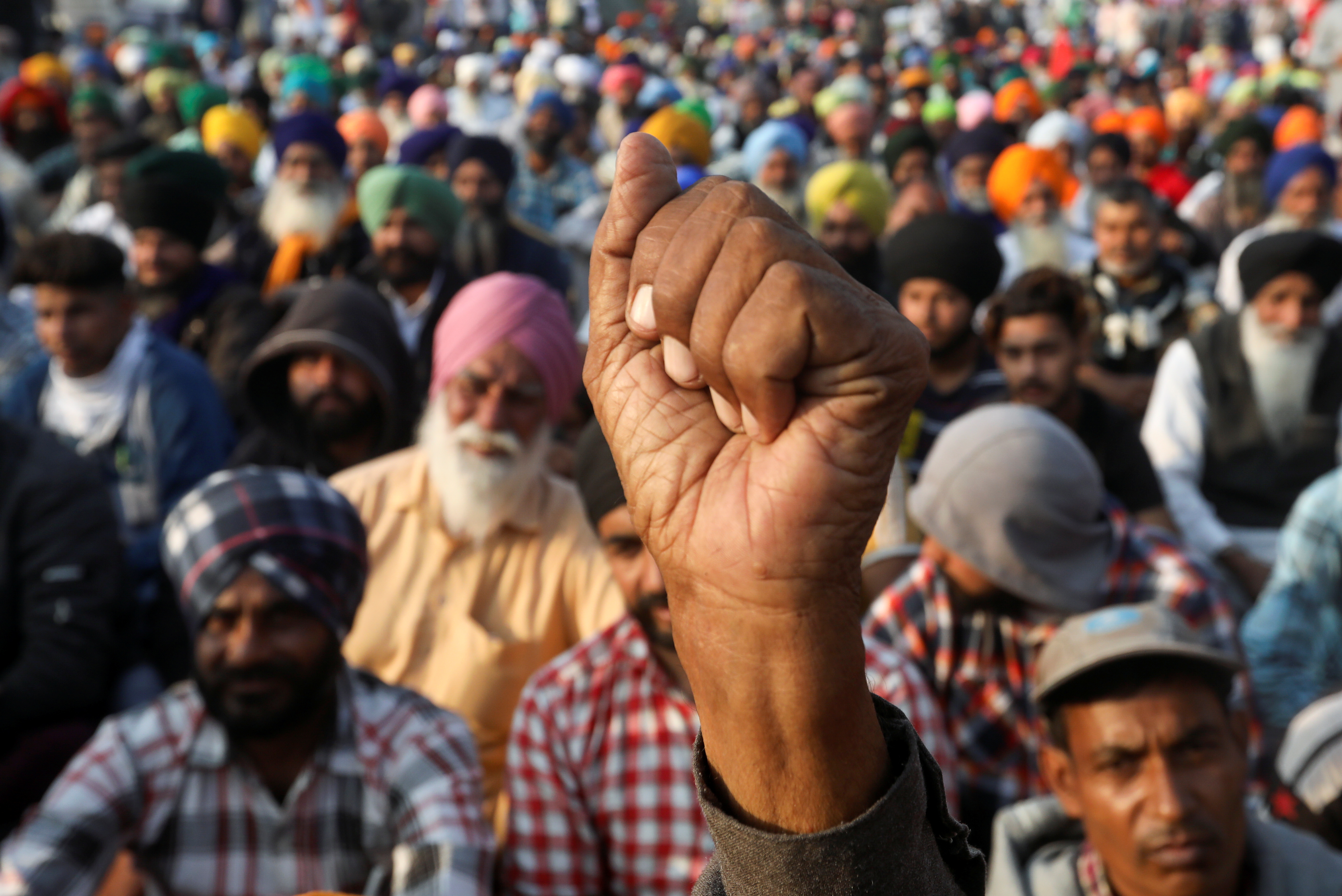 A demonstrator gestures during a protest against the newly passed farm bills at Singhu border near New Delhi, India, December 10, 2020. Photo: Reuters