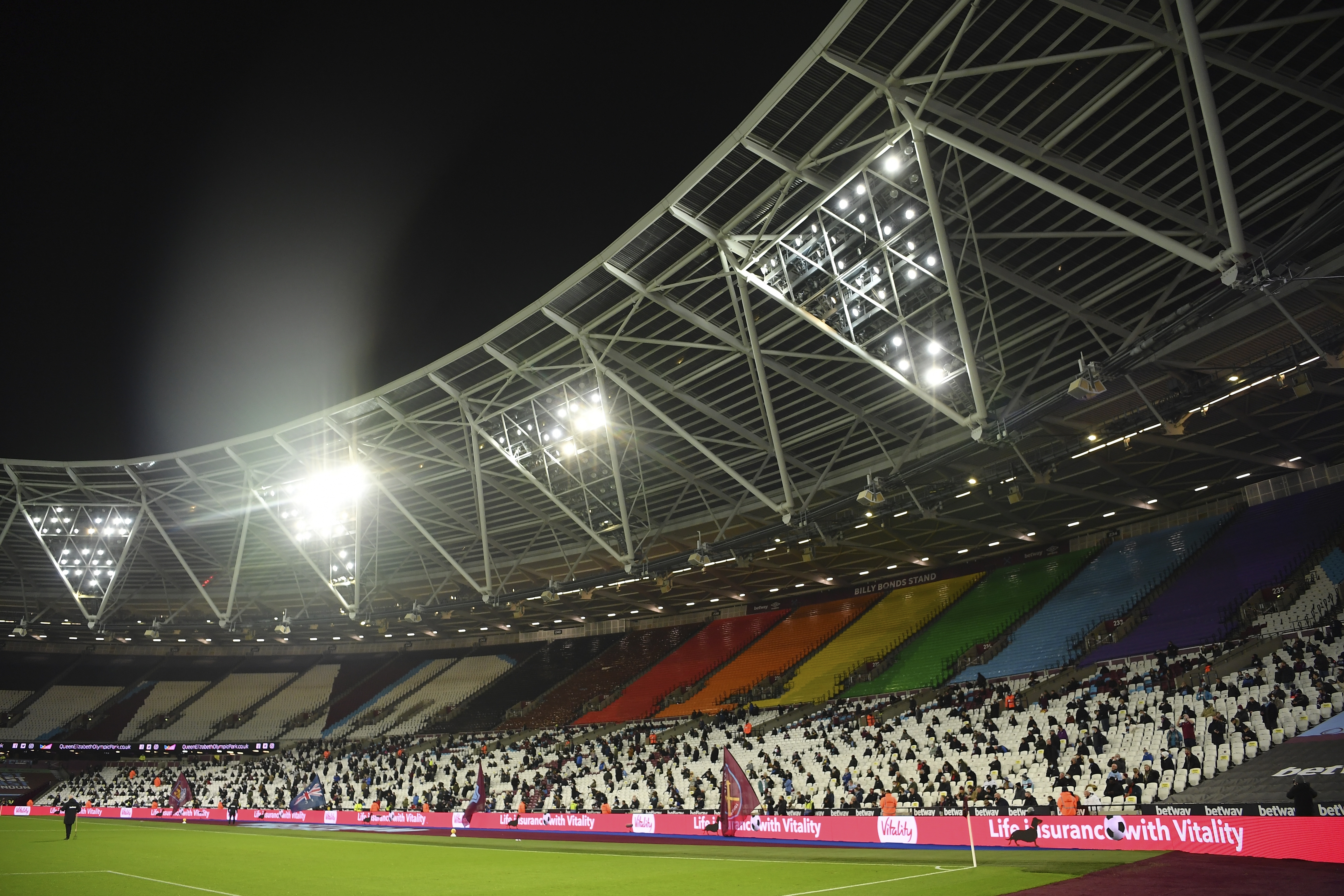 Fans are socially distanced as they wait for kick off ahead of the English Premier League soccer match between West Ham United and Manchester United at the London stadium in London, England, Saturday, Dec. 5, 2020. Photo: AP