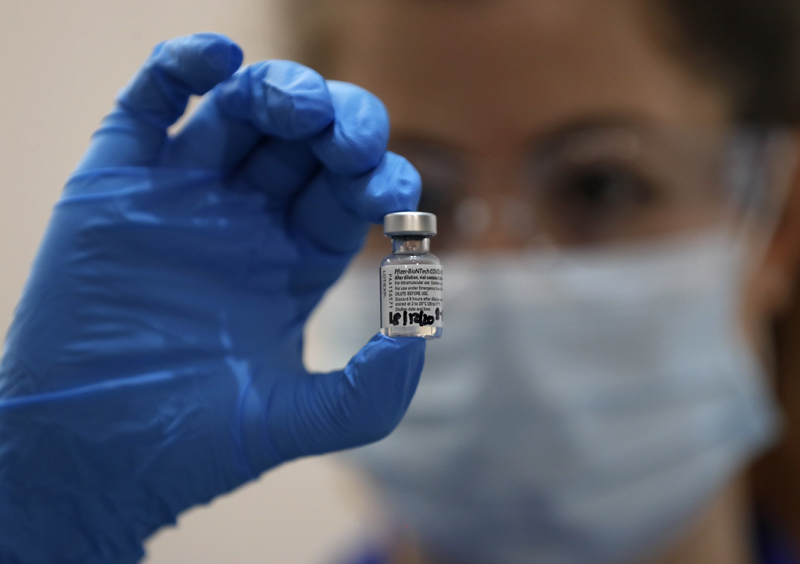 A nurse holds a phial of the Pfizer-BioNTech COVID-19 vaccine at Guy's Hospital in London, Tuesday, Dec. 8, 2020, as the U.K. health authorities rolled out a national mass vaccination program.  Photo: AP