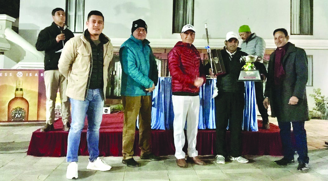 Rabindra Tiwari celebrates with the winneru2019s trophy after the Chivas Open Golf Tournament at the Gokarna Golf Club in Kathmandu on Saturday. Photo Courtesy: Gokarna Golf Club