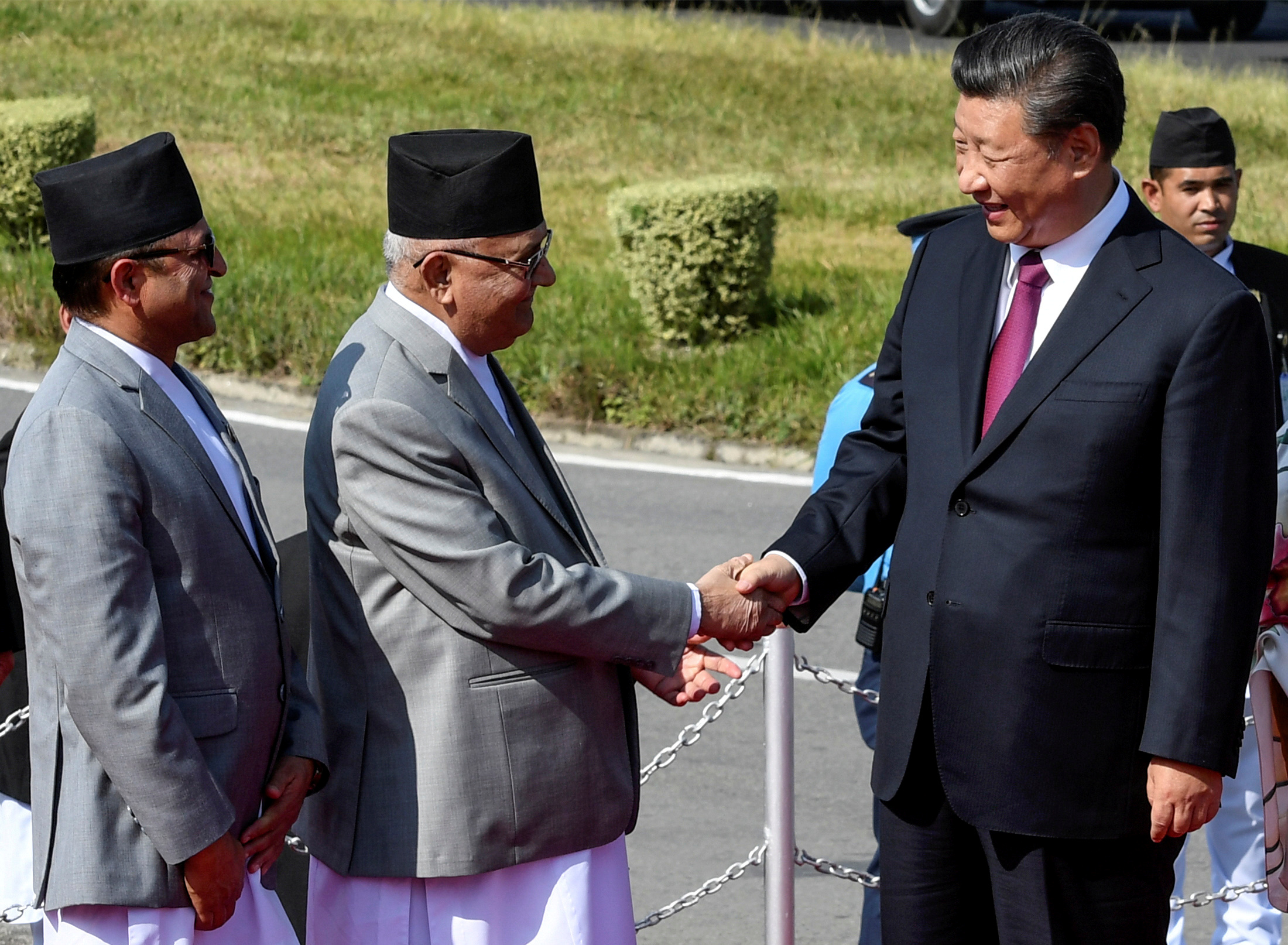 FILE PHOTO: China's President Xi Jinping shakes hands with Nepal's Prime Minister KP Sharma Oli as he wraps up his two-day visit to Nepal, in Kathmandu October 13, 2019. Photo: Reuters 