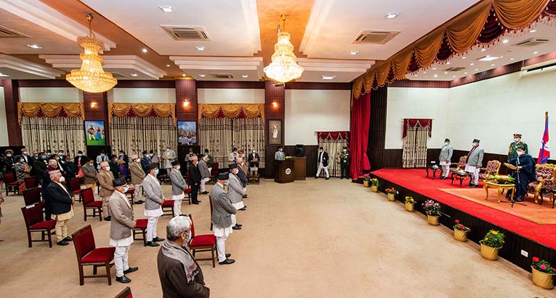 This image shows the newly appointed ministers taking oath of office and secrecy during the meeting of the Council of Ministers at Prime Minister's official residence in Baluwatar, Kathmandu, on Friday, December 25, 2020. Photo: PM's Private Secretariat/Rajan Kafle