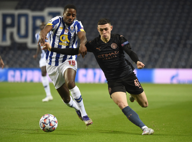 Manchester City's Phil Foden in action with FC Porto's Wilson Manafa n during the Champions League Group C match between FC Porto and Manchester City, at Estadio do Dragao, in Porto, Portugal, on December 1, 2020. Photo:  Pool via Reuters