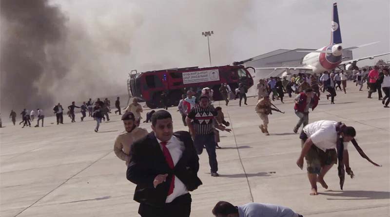 People run following an explosion at the airport in Aden, Yemen, shortly after a plane carrying the newly formed Cabinet landed on Wednesday, December 30, 2020. Photo: AP