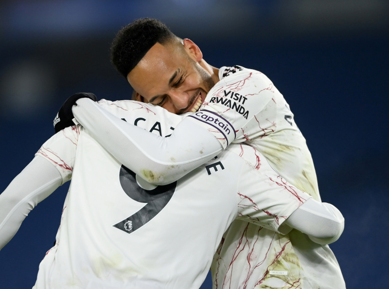 Arsenal's Alexandre Lacazette celebrates scoring their first goal with Pierre-Emerick Aubameyang during the Premier League match between Brighton & Hove Albion and Arsenal, at The American Express Community Stadium, in Brighton, Britain, on December 29, 2020. Photo: Pool via Reuters
