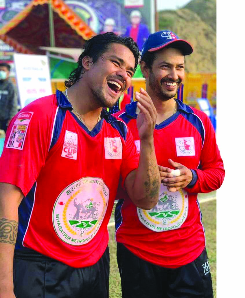 Narayaniu2019s Karan KC (left) celebrates with skipper Subash Khakurel after their victory over Bagmati in the Gautam Buddha Cup in Chitwan on Saturday. Photo: THT