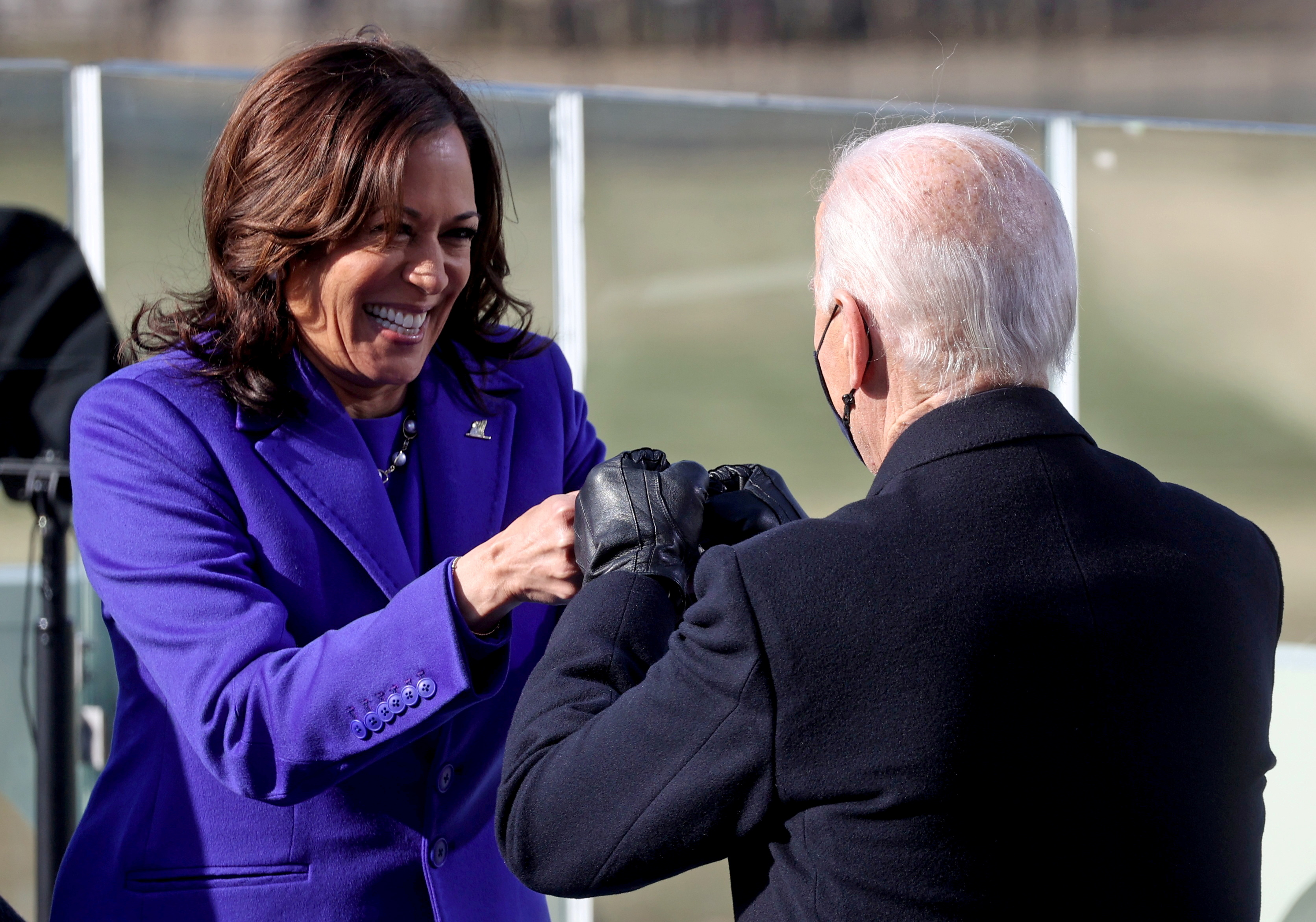 Kamala Harris bumps fists with Joe Biden after being sworn in as Vice President of the United States during the inauguration on the West Front of the U.S. Capitol in Washington, U.S., January 20, 2021. REUTERS/Jonathan Ernst/Pool     TPX IMAGES OF THE DAY