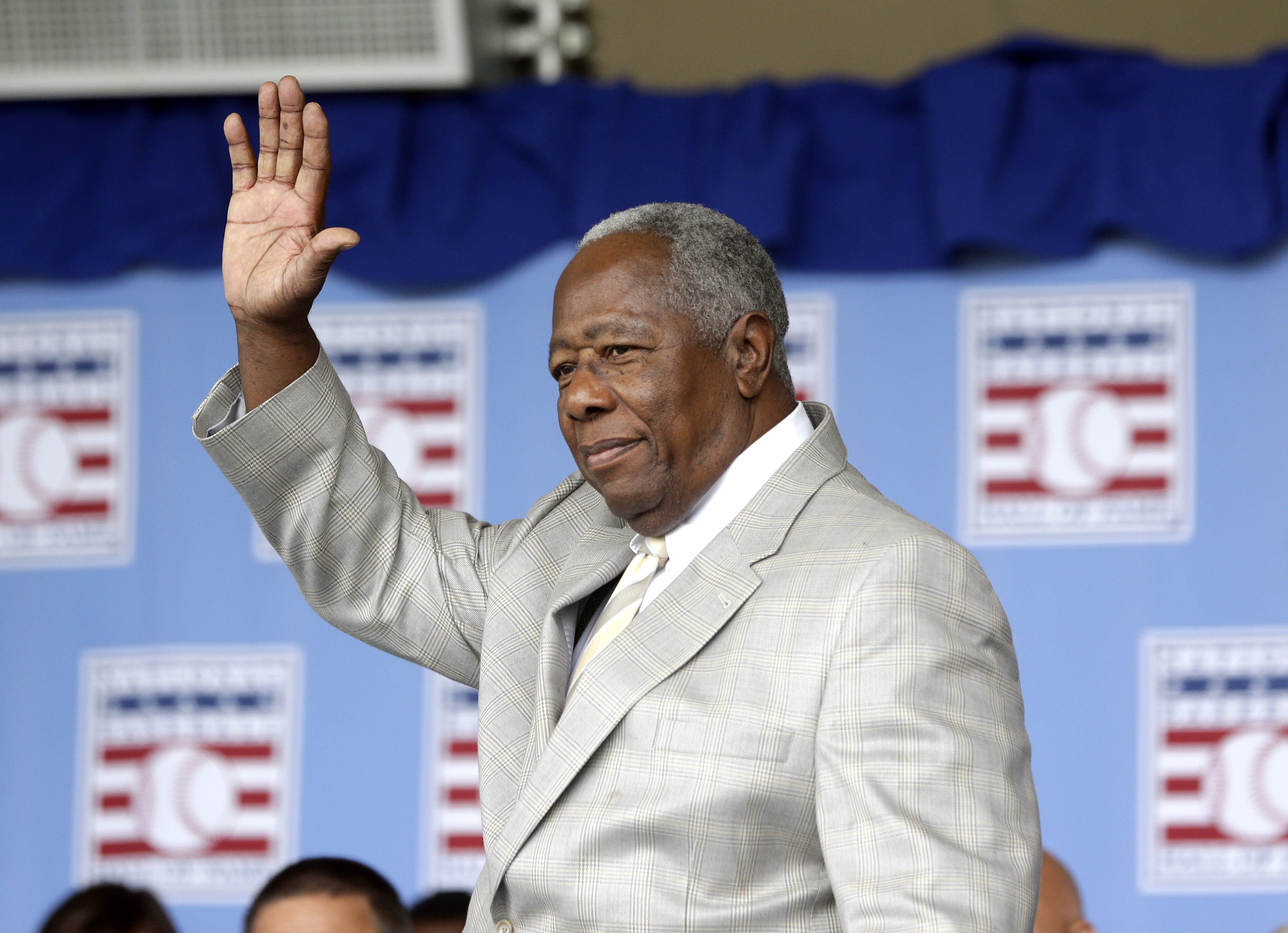 FILE - Hall of Famer Hank Aaron waves to the crowd during Baseball Hall of Fame induction ceremonies in Cooperstown, N.Y., in this Sunday, July 28, 2013, file photo. Hank Aaron, who endured racist threats with stoic dignity during his pursuit of Babe Ruth but went on to break the career home run record in the pre-steroids era, died early Friday, Jan. 22, 2021. He was 86. The Atlanta Braves said Aaron died peacefully in his sleep. No cause of death was given. Photo: AP