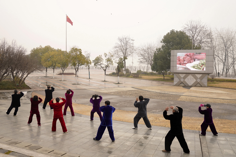Residents practice Taiji at a park in Wuhan in central China's Hubei Province on Saturday, Jan. 23, 2021. Photo: AP