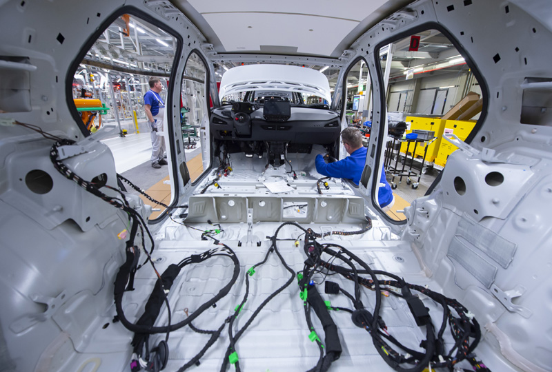In this Tuesday, Feb. 25, 2020 file photo, a worker completes an electric car ID.3 body at the assembly line, during a press tour at the plant of the German manufacturer Volkswagen AG, VW, in Zwickau, Germany. Automaker Volkswagen tripled sales of battery-only cars last year as its new electric compact ID.3 came on the market ahead of tough new limits on auto emissions. Photo:AP/file