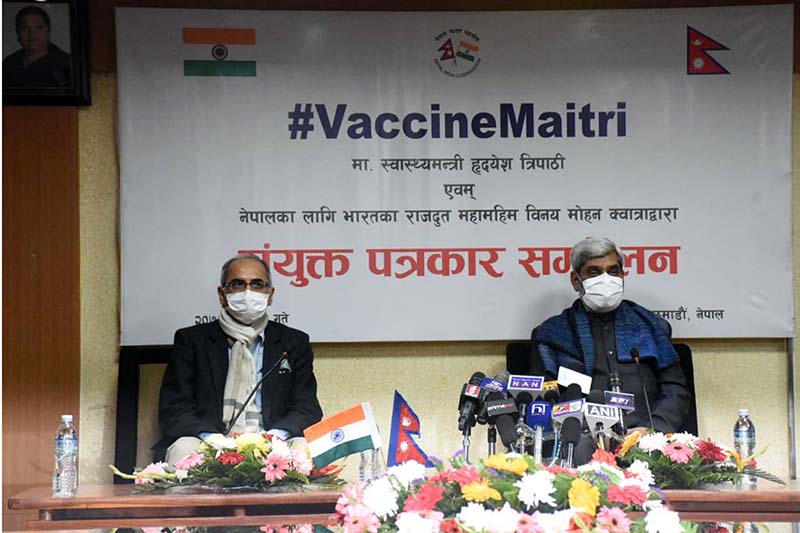 Indian Ambassador to Nepal Vinay Mohan Kwatra (left) and Minister for Health and population Hridayesh Tripathi attend a  joint press meet organised at the Ministry of Health and Population in Kathmandu, on Wednesday, January 20, 2021. The Government of India is Providing one million doses of COVID-19 vaccine to Nepal. Photo: RSS