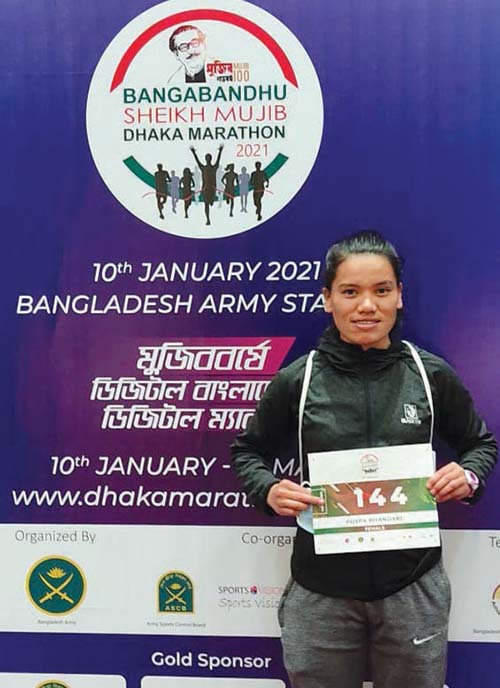 Nepali athlete Pushpa Bhandari displays her number during Bangabandhu Sheikh Mujib Dhaka Marathon in Bangladesh on Sunday, January 10, 2021. She won gold medal. Photo: THT