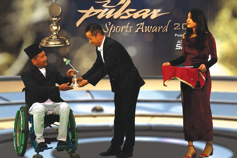 Digam Singh Chemjong receiving the Para-athelte award during the Pulsar Sports Award ceremony, at the International Sports Complex in Lalitpur, on Tuesday, January 12, 2021. Photo courtesy: NSJF