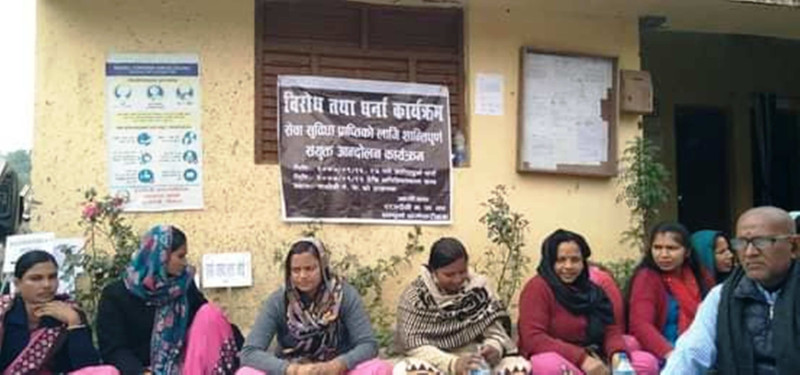 Rajdevi Municipality employees staging a sit-in outside the municipality office, in Rautahat, on Sunday. Photo: THT