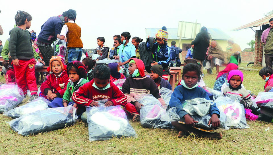 Students of Sharada Preliminary School being provided different items at a programme in the school in Hanumannagar Kankalini Municipality, Saptari, on Wednesday. Photo: THT