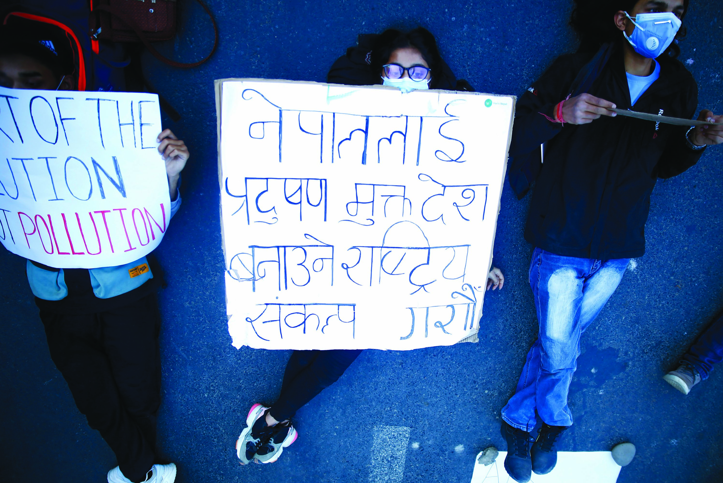Social activists staging a protest against the government demanding better air quality and environment in Kathmandu, on Wednesday. Photo: Skanda Gautam / THT