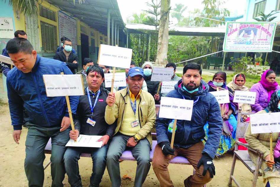 Health workers and hospital employees staging a sit-in demanding their COVID risk allowance, in District Hospital, Kalaiya, on Tuesday. Photo: THT